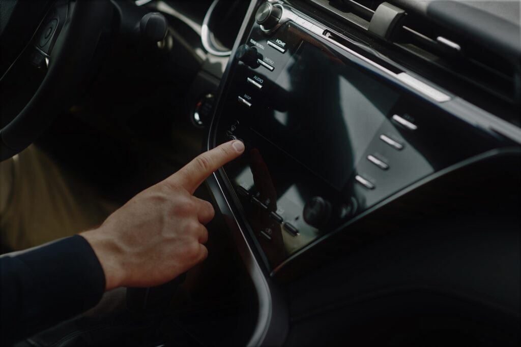 Man includes an audio system in the car.